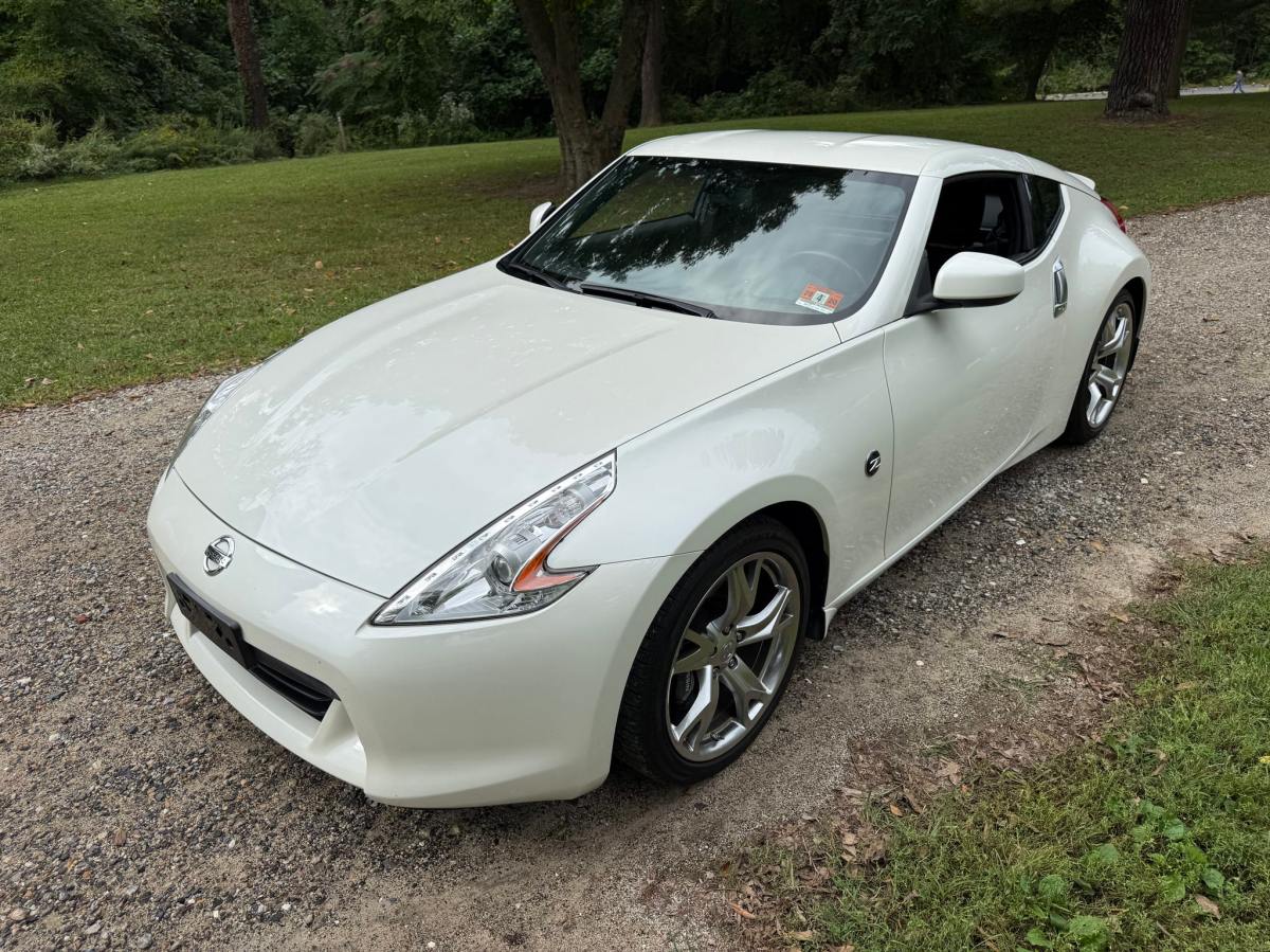 25k-Mile 2011 Nissan 370Z Touring Coupe 6-Speed — exterior front three-quarter view